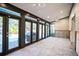 Sunroom with pool view and access to backyard at 4911 W Juno St, Tampa, FL 33629