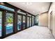 Sunroom with pool view and access to backyard at 4911 W Juno St, Tampa, FL 33629