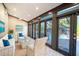 Bright sunroom with pool view, comfy wicker furniture, and large windows at 4911 W Juno St, Tampa, FL 33629