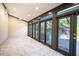 Sunroom with pool view and access to backyard at 4911 W Juno St, Tampa, FL 33629
