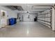 Two-car garage featuring epoxy flooring and storage at 1820 Mira Lago Cir, Ruskin, FL 33570