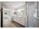 Elegant bathroom with double vanity and a separate shower at 3051 27 E Ct, Palmetto, FL 34221