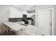 Modern kitchen with white cabinets, granite countertops and stainless steel appliances at 3051 27 E Ct, Palmetto, FL 34221