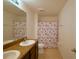 Bathroom with double vanity and flamingo shower curtain at 3505 San Moise Pl, Plant City, FL 33567