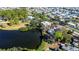 House nestled by a lake, surrounded by other homes at 6626 1St N St, St Petersburg, FL 33702