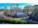 Aerial view of a house with a metal roof and surrounding trees at 6626 1St N St, St Petersburg, FL 33702