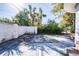 Large backyard with concrete patio and mature landscaping at 6626 1St N St, St Petersburg, FL 33702