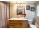 Clean bathroom with wooden vanity and bathtub at 6626 1St N St, St Petersburg, FL 33702