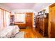 Cozy bedroom with hardwood floors and built-in shelving at 6626 1St N St, St Petersburg, FL 33702