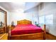 Bedroom with a large bed and wood flooring at 6626 1St N St, St Petersburg, FL 33702