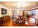 Bright dining room with hardwood floors, chandelier and views to kitchen at 6626 1St N St, St Petersburg, FL 33702
