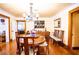 Elegant dining room with hardwood floors, chandelier, and period furniture at 6626 1St N St, St Petersburg, FL 33702