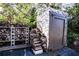 Wood storage shed with stacked firewood beside it at 6626 1St N St, St Petersburg, FL 33702