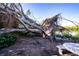 Large fallen tree near waterfront with mosaic table at 6626 1St N St, St Petersburg, FL 33702