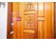 Close-up of the intricately carved wooden front door at 6626 1St N St, St Petersburg, FL 33702