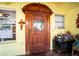 Ornate wooden front door adds character and charm to the home's entrance at 6626 1St N St, St Petersburg, FL 33702