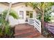 Brick steps leading to front door with white railing at 6626 1St N St, St Petersburg, FL 33702