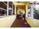 Bright and airy front porch with terracotta tile flooring at 6626 1St N St, St Petersburg, FL 33702