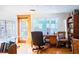 Bright home office features built-in shelving, wood floors, and large windows at 6626 1St N St, St Petersburg, FL 33702