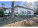 Single story home with large windows and mature tree at 6626 1St N St, St Petersburg, FL 33702