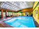 Relaxing indoor pool with colorful walls and tiled flooring at 6626 1St N St, St Petersburg, FL 33702