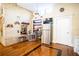 Bright kitchen features brick wall, stainless steel appliances, and wood floors at 6626 1St N St, St Petersburg, FL 33702
