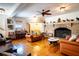 Large living room with hardwood floors, fireplace, and leather furniture at 6626 1St N St, St Petersburg, FL 33702