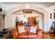 Living room with leather couch and view through arched entryway at 6626 1St N St, St Petersburg, FL 33702