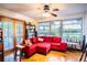 Spacious living room with red sectional sofa and water views at 6626 1St N St, St Petersburg, FL 33702