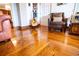 Living room features hardwood floors and comfortable leather arm chair at 6626 1St N St, St Petersburg, FL 33702