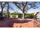 Spacious patio with seating area and a large shade tree at 6626 1St N St, St Petersburg, FL 33702