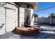 Side entrance with brick steps and an ornate metal gate at 6626 1St N St, St Petersburg, FL 33702