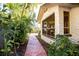 Sidewalk path through lush landscaping to the home at 6626 1St N St, St Petersburg, FL 33702