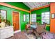 Sunroom with table and chairs, offering a bright and airy space at 6626 1St N St, St Petersburg, FL 33702