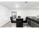 Bright dining room with a modern table, stylish black chairs, and unique decorative mirror at 5327 New Friendship Pl, Tampa, FL 33619
