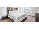 A well-lit main bedroom features a plush bed and modern decor, creating a comfortable retreat at 5327 New Friendship Pl, Tampa, FL 33619