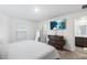 A well-lit main bedroom featuring TV and modern furnishings, creating a cozy retreat at 5327 New Friendship Pl, Tampa, FL 33619