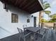 The back porch includes dining set with views of the backyard at 1793 N Fort Harrison Ave, Clearwater, FL 33755