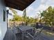 Back porch includes a dining table and overlooks the yard at 1793 N Fort Harrison Ave, Clearwater, FL 33755