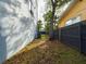 Side yard featuring a tree, privacy fence and an air conditioning unit at 1793 N Fort Harrison Ave, Clearwater, FL 33755