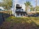 Charming modern home with balconies overlooking fenced backyard, providing ample space for recreation at 1793 N Fort Harrison Ave, Clearwater, FL 33755