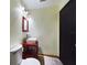 The bathroom features a unique square sink with a striking red vanity at 1793 N Fort Harrison Ave, Clearwater, FL 33755