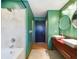Stylish bathroom with double sinks, tiled shower, and modern fixtures at 1793 N Fort Harrison Ave, Clearwater, FL 33755
