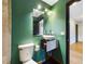 This bathroom features a vessel sink, modern fixtures, a toilet, and a shower-over-tub at 1793 N Fort Harrison Ave, Clearwater, FL 33755