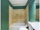 Bathroom featuring a tiled shower-over-tub combination, toilet, and modern fixtures at 1793 N Fort Harrison Ave, Clearwater, FL 33755