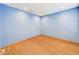 Blue bedroom featuring recessed lighting and hardwood floors at 1793 N Fort Harrison Ave, Clearwater, FL 33755