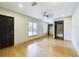 Spacious bedroom featuring light hardwood floors and a ceiling fan at 1793 N Fort Harrison Ave, Clearwater, FL 33755