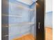 View of an open closet reveals multiple wire shelves for easy storage at 1793 N Fort Harrison Ave, Clearwater, FL 33755