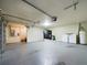 Spacious garage with washer, dryer and access door to the living area at 1793 N Fort Harrison Ave, Clearwater, FL 33755