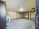 A spacious two-car garage equipped with a washing machine and water heater at 1793 N Fort Harrison Ave, Clearwater, FL 33755